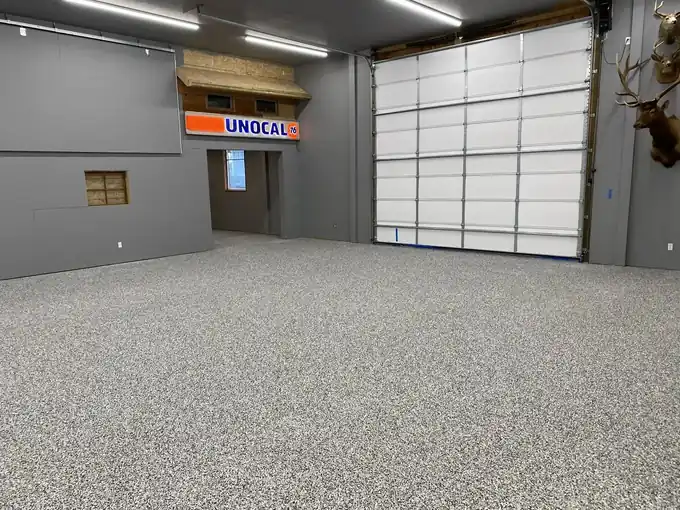 The same shop with grey multi-colour chip broadcast across the entire floor