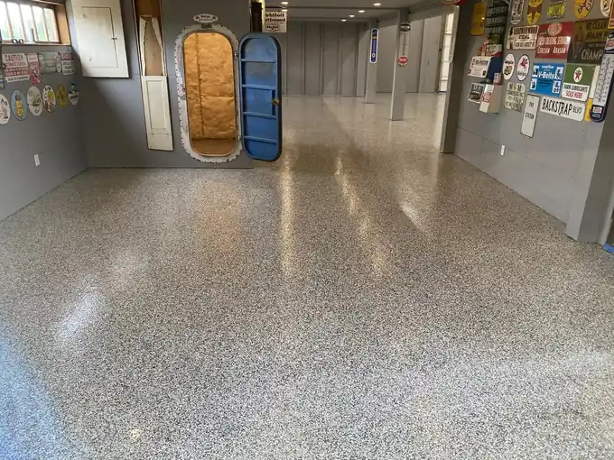 Finished flake epoxy floor in a shop with vintage signs on the walls