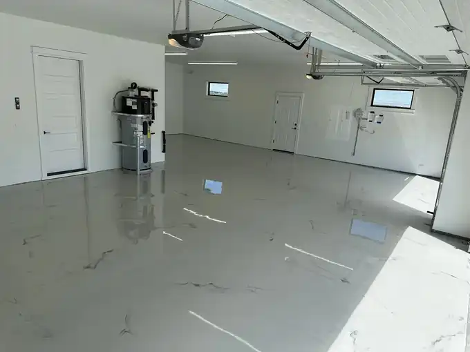 White marble look metallic epoxy floor in a garage
