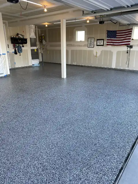 Blue and grey flake epoxy floor in a residential garage